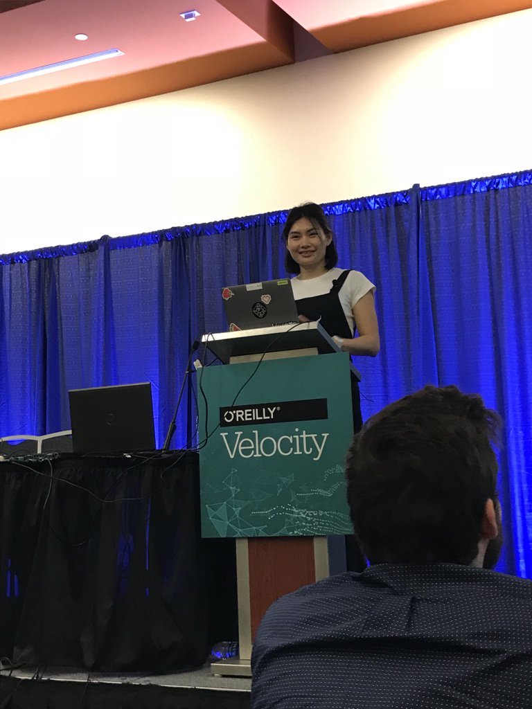 A photograph of me speaking at O'Reilly Velocity in 2018